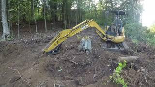 Installing a new driveway up steep terrain, camper pad, land clearing