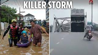 Vehicles plunge into river in bridge collapse as 126mph Typhoon Yagi brings destruction killing 82