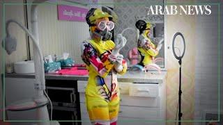 Indonesian dentist boosts patients' mood with colourful hazmat suits