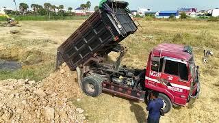 New Filling Up Land Starting Project By KOMATSU D31p Bulldozer With Dump Trucks Dumping Soil Into,,