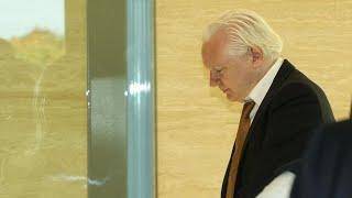 Julian Assange arrives at court
