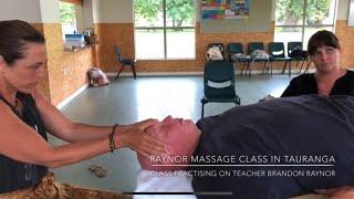 Group massage. Raynor massage students practising on school principal Brandon Raynor